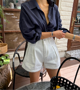 Women's lace trim high waist denim shorts with a loose fit.